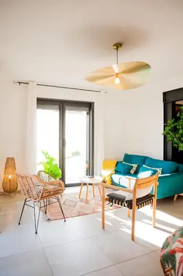 a dining room with a table and chairs at Maison Nomade piscine privée, parking et clim in Carcassonne