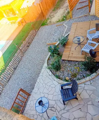 an overhead view of a patio with chairs and a table at l'Entre Nous, jacuzzi privé et piscine à Carcassonne in Carcassonne