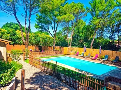 a swimming pool with a fence around it at l'Entre Nous, jacuzzi privé et piscine à Carcassonne in Carcassonne