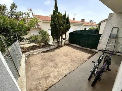 two bikes parked outside of a house at Maison 3 pièces PORT LA NOUVELLE PN080-006 in Port-la-Nouvelle