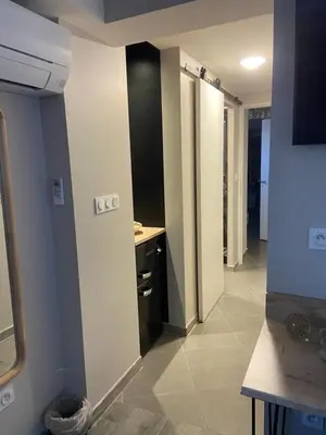 a hallway of a room with a sink and a bathroom at Chambres chez l'habitant in Salles-d'Aude