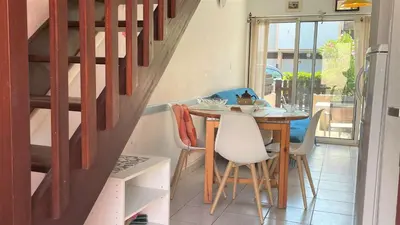 a dining room with a table and chairs at APPARTEMENT 3 pieces PORT LA NOUVELLE PN340-126 in Port-la-Nouvelle