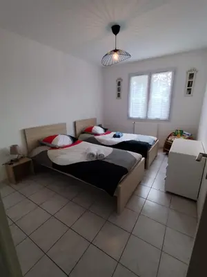 a bedroom with two beds and a ceiling at Chez Maxou - 3 ēpis Jardin Clos-Garage-Dogfriendly in Revel