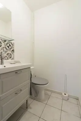 a white bathroom with a toilet and a sink at Chez Maxou - 3 ēpis Jardin Clos-Garage-Dogfriendly in Revel