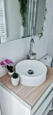 a bathroom with a white sink and a mirror at N1-Terrasse - Barbacane - Pieds Cité - Clime Mobile in Carcassonne