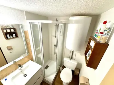a bathroom with a shower and a toilet and a sink at Maison deux pièces cabine PORT LA NOUVELLE PN370-026 in Port-la-Nouvelle