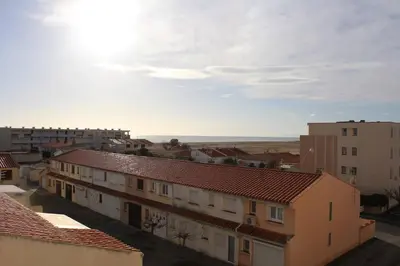 a view of a city with buildings and the sky at Appartement 2 pièces PORT LA NOUVELLE PN440-024 in Port-la-Nouvelle