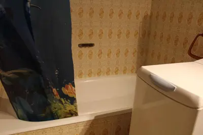 a bathroom with a tub and a shower curtain at Appartement 2 pièces PORT LA NOUVELLE PN440-024 in Port-la-Nouvelle