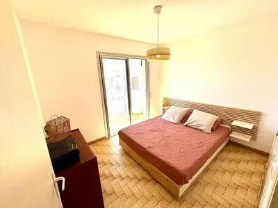 a bedroom with a bed in a room at Appartement 3 pièces Port-la-Nouvelle PN550-012 in Port-la-Nouvelle