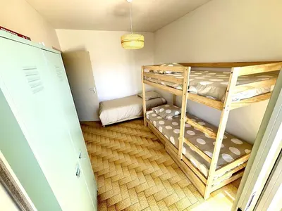 a small room with two bunk beds in it at Appartement 3 pièces Port-la-Nouvelle PN550-012 in Port-la-Nouvelle