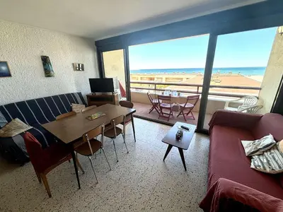 a living room with a couch and a table at Appartement 2 pièces - Port La Nouvelle PN590-025 in Port-la-Nouvelle