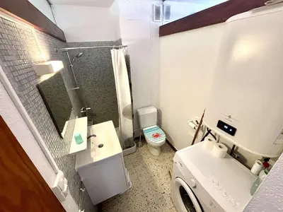 a small bathroom with a toilet and a sink at Appartement 2 pièces - Port La Nouvelle PN590-025 in Port-la-Nouvelle