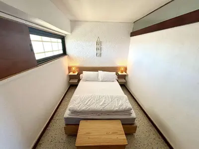 a small room with a bed and a window at Appartement 2 pièces - Port La Nouvelle PN590-025 in Port-la-Nouvelle