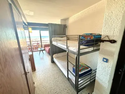 a room with a bunk bed in a room at Appartement 2 pièces - Port La Nouvelle PN590-025 in Port-la-Nouvelle