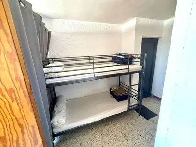 a room with a bunk bed in a room at Appartement 2 pièces - Port La Nouvelle PN590-025 in Port-la-Nouvelle