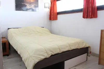 a small bedroom with a bed with at Appartement 2 pièces PORT LA NOUVELLE PN590-033 in Port-la-Nouvelle