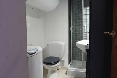 a white bathroom with a toilet and a sink at Appartement 2 pièces PORT LA NOUVELLE PN590-033 in Port-la-Nouvelle