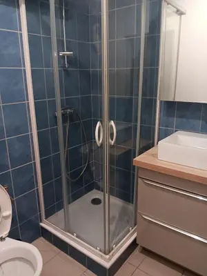 a bathroom with a shower with a toilet and a sink at Studio in Lézignan-Corbières