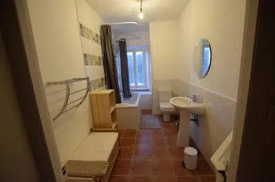 a bathroom with a sink and a toilet and a mirror at l escapade Corbières in Lagrasse