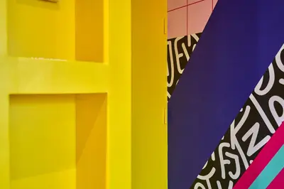 a close up of a colorful lego building at La Villa Orange - POP'ART - proche cité médiévale et centre ville à pied in Carcassonne