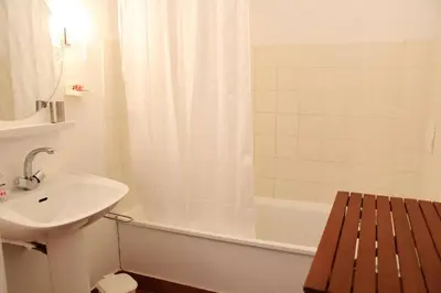 a bathroom with a sink and a toilet and a tub at Appartement 3 pièces PORT LA NOUVELLE PN210-064 in Port-la-Nouvelle