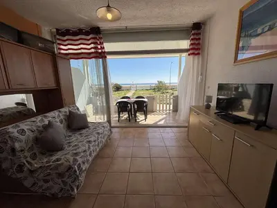 a kitchen with a black refrigerator and a sink at Appartement 2 pièces PORT LA NOUVELLE PN430-027 in Port-la-Nouvelle