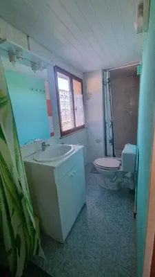a bathroom with a sink and a toilet at L'Orchidée chambres d'hôtes in Hounoux