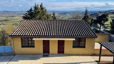 a small house with a roof with a view at L'Orchidée chambres d'hôtes in Hounoux
