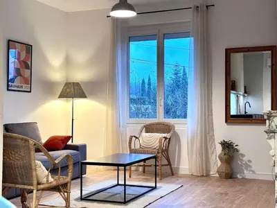 a living room with a table and chairs and a window at T3 l 65m 2 l Bright & Quiet in Castres
