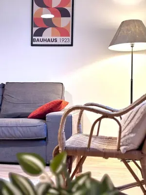 a living room with a chair and a couch at T3 l 65m 2 l Bright & Quiet in Castres
