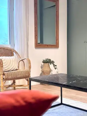 a living room with a coffee table and a chair at T3 l 65m 2 l Bright & Quiet in Castres