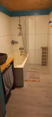 a bathroom with a shower and a bath tub at Maison calme in Payrin-Augmontel