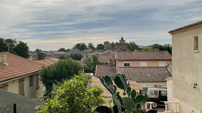 a view of a city with houses and roofs at Modern apartment centrally located in Quarante in Quarante