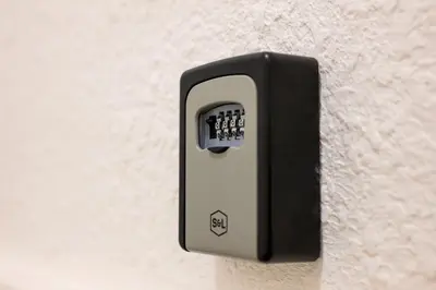 a black and white switch on a wall at La Pause Carcassonnaise in Carcassonne