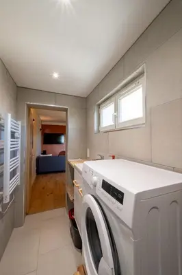 a laundry room with a washer and dryer at La Pause Carcassonnaise in Carcassonne
