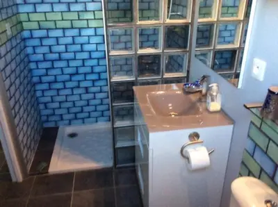 a bathroom with a sink and a shower at Domaine Castelsec in Roquefort-des-Corbières