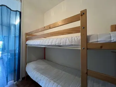 a couple of bunk beds in a room at Appartement Studio Cabine - Gruissan GN020-211 in Gruissan