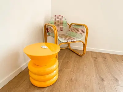 a chair sitting on top of a stack of orange furniture at Maison Agane - accès canal du midi, piscine chauffée in Pexiora