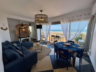 a living room with a couch and a dining table at Appartement 2 pièces vue mer Port La Nouvelle PN400-034 in Port-la-Nouvelle