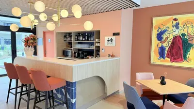 a bar in a restaurant with chairs and tables at DOMITYS - Carmina in Carcassonne