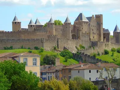 a large castle sitting on top of a hill at DOMITYS - Carmina in Carcassonne