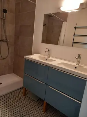 a bathroom with a sink and a mirror and a tub at Domaine Saint Augustin in Rieux-Minervois