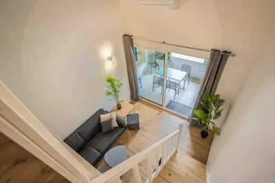 an overhead view of a living room with a couch at L'Hippocrate Duplex à deux pas des Halles in Narbonne