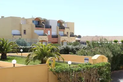 a view of a apartment complex from a balcony at Appartement calme avec piscine commune et loggia GN050-489 in Gruissan