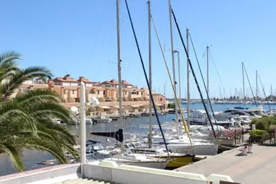 a bunch of boats docked in a marina with buildings at Appartement cosy avec vue et piscine sur le port - GN400-013 in Gruissan