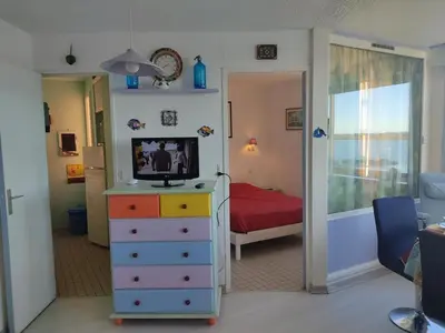a bedroom with a bed and a television on a dresser at T2 Spacieux, Proche Plage, Parking Privé - FR-1-796-82 in Gruissan