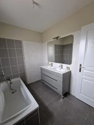 a bathroom with a tub and a sink and a bath tub at Villa avec piscine privée in Sallèles-dʼAude