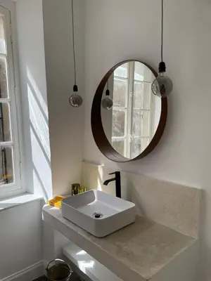 a bathroom with a white sink and a mirror at Artist Residence - courtyard, terrace, Grand Piano in Siran