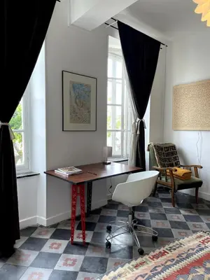 a home office with a desk and a chair at Artist Residence - courtyard, terrace, Grand Piano in Siran