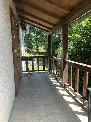 a porch of a house with a table on it at Maison de Vacances in Pradelles-Cabardès
